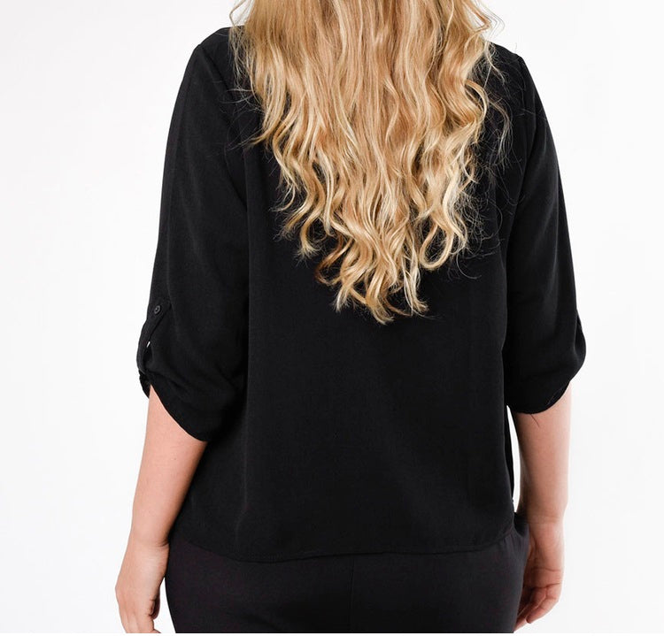 Blusa negra holgada